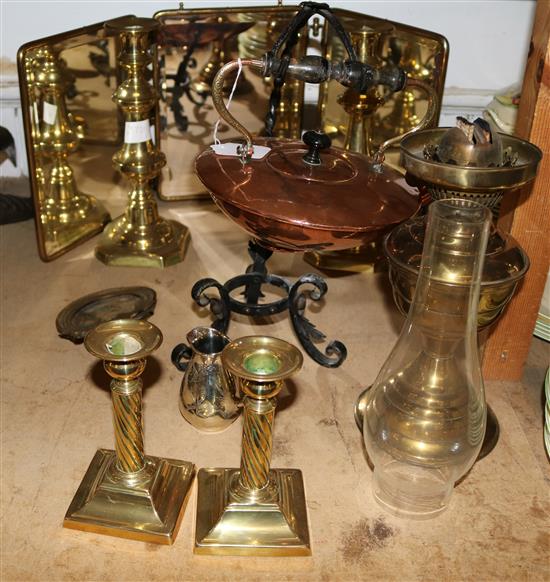 Two pairs of brass pillar candlesticks, brass oil lamp, a mirrored triple screen and a miniature frame